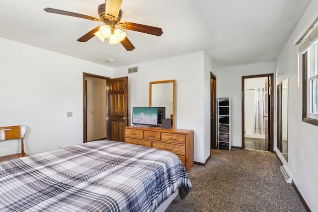 bedroom with connected bathroom, ceiling fan, and carpet flooring