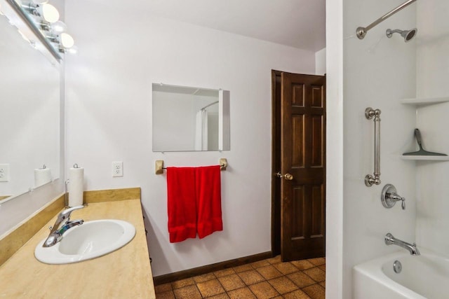 bathroom featuring vanity, tub / shower combination, and tile patterned floors