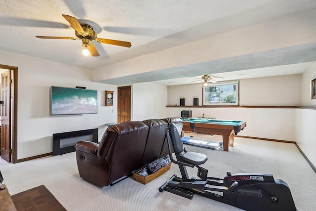 interior space featuring light carpet, pool table, and ceiling fan