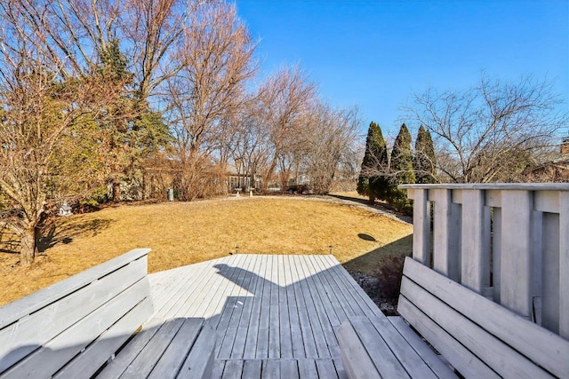 wooden deck with a lawn