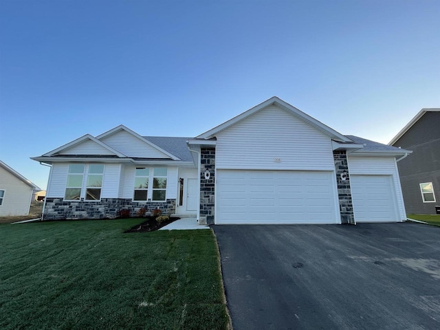 single story home with a garage and a front yard