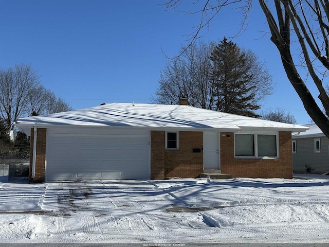 single story home featuring a garage