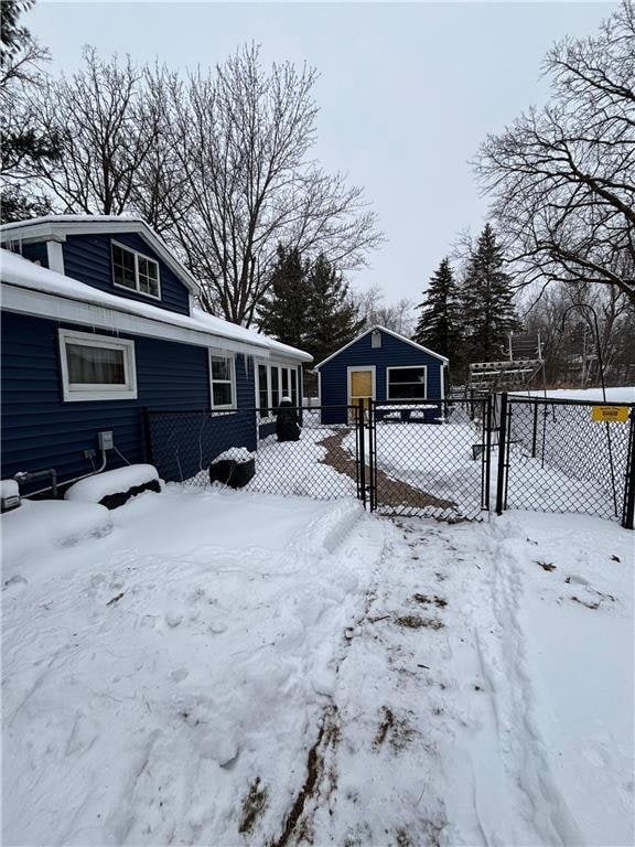 exterior space featuring a garage and an outdoor structure