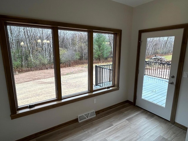 doorway with light hardwood / wood-style flooring