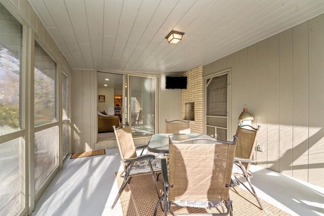 sunroom / solarium with wood ceiling