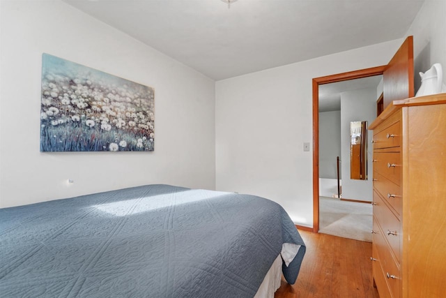 bedroom with light hardwood / wood-style flooring