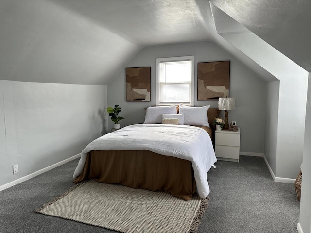 carpeted bedroom featuring lofted ceiling and a textured ceiling