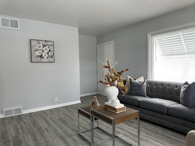 living room with dark hardwood / wood-style flooring