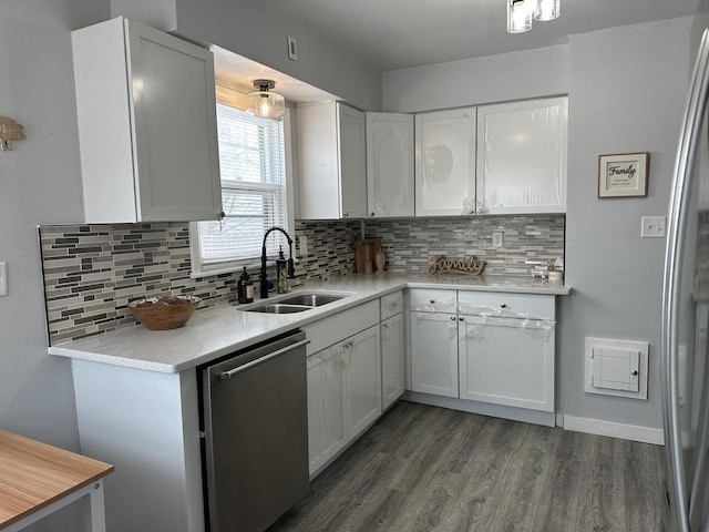 kitchen with sink, dark hardwood / wood-style floors, white cabinets, and appliances with stainless steel finishes