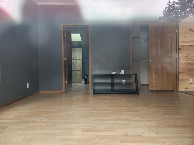 unfurnished room with light hardwood / wood-style floors