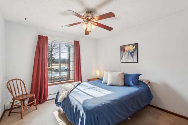 bedroom with baseboards, light colored carpet, a textured ceiling, and baseboard heating