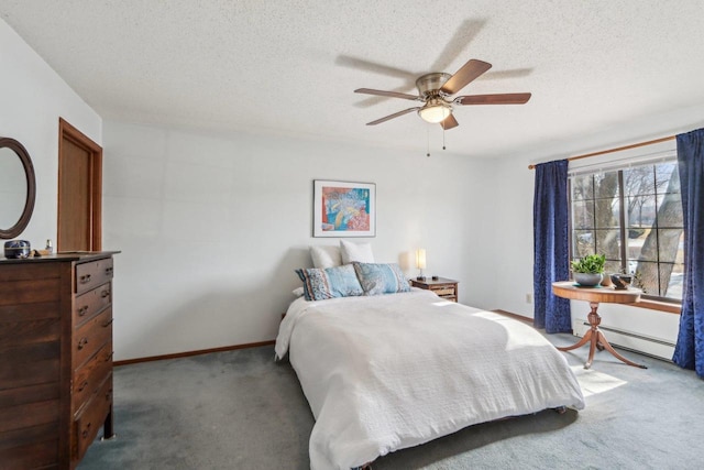 bedroom with a textured ceiling, ceiling fan, a baseboard radiator, and carpet flooring