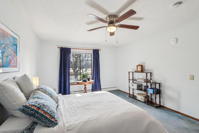 carpeted bedroom featuring baseboards, baseboard heating, and a textured ceiling