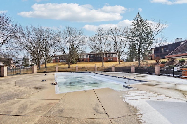 view of pool with fence