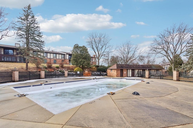 pool with fence and a patio