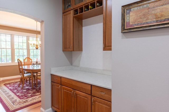 kitchen featuring a notable chandelier and decorative light fixtures