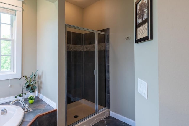 bathroom with independent shower and bath and tile patterned flooring