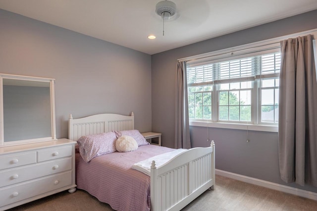 carpeted bedroom with ceiling fan