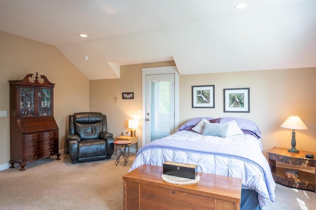 bedroom featuring vaulted ceiling and light colored carpet