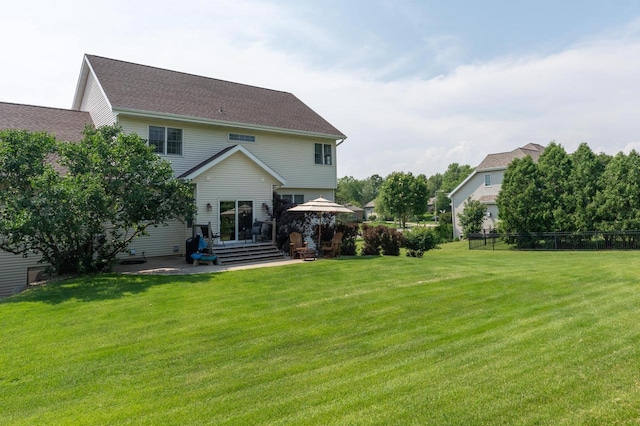 back of house featuring a gazebo, a patio area, and a lawn