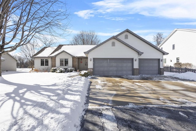 single story home with a garage