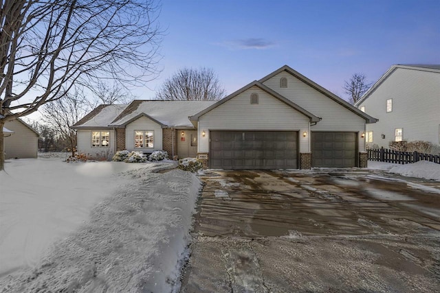 single story home with a garage