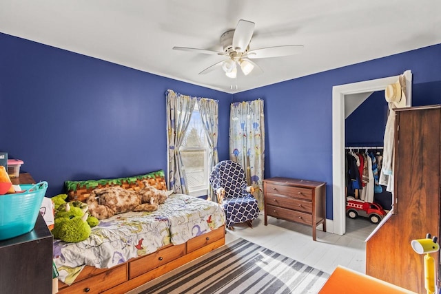 bedroom featuring ceiling fan and a closet