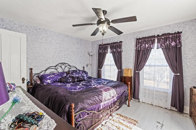 bedroom featuring ceiling fan and light hardwood / wood-style floors