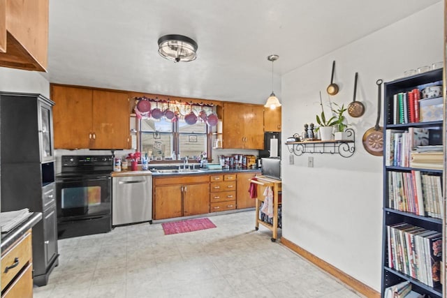 kitchen featuring hanging light fixtures, sink, black electric range oven, and stainless steel dishwasher