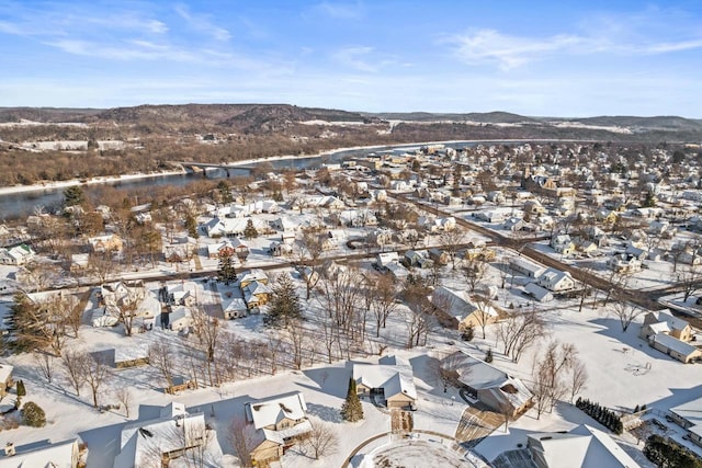 snowy aerial view with a mountain view