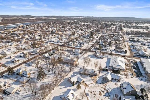 snowy aerial view featuring a mountain view