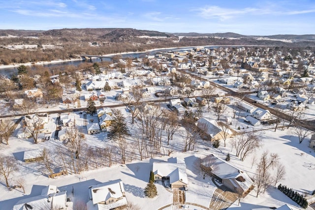 snowy aerial view featuring a mountain view