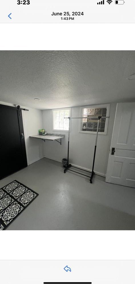 interior space featuring a textured ceiling