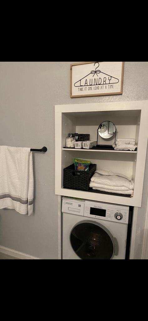 clothes washing area featuring washer / clothes dryer