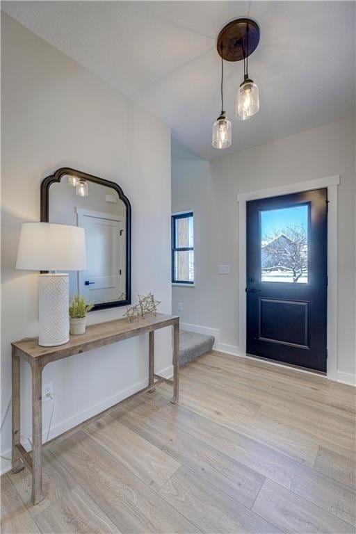 foyer entrance featuring plenty of natural light and light wood-type flooring