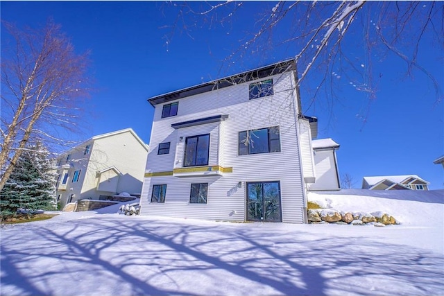 view of snow covered house