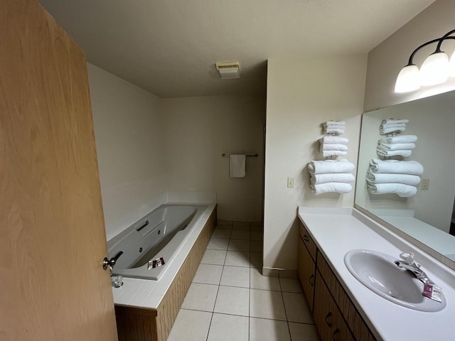 full bathroom with a whirlpool tub, tile patterned flooring, and vanity