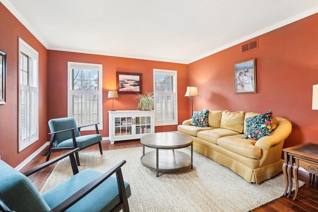 living room with crown molding and hardwood / wood-style floors