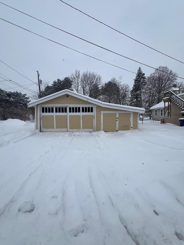 view of snow covered garage