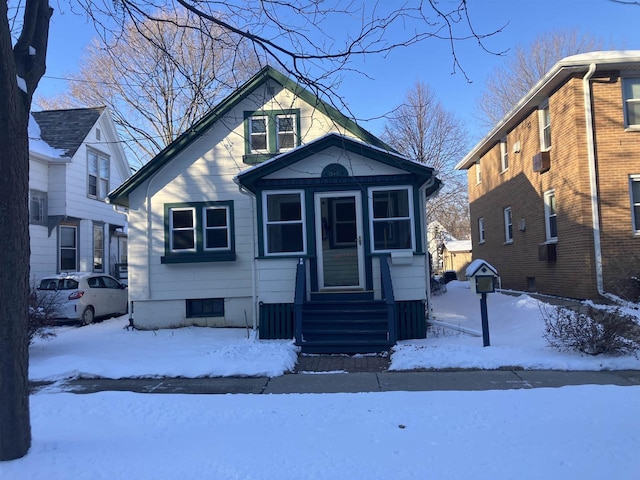 bungalow-style house featuring entry steps