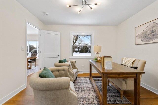 home office with hardwood / wood-style floors