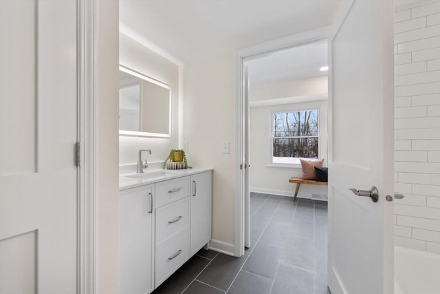 bathroom with vanity and tile patterned flooring