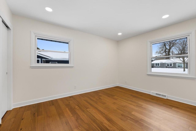 empty room with wood-type flooring