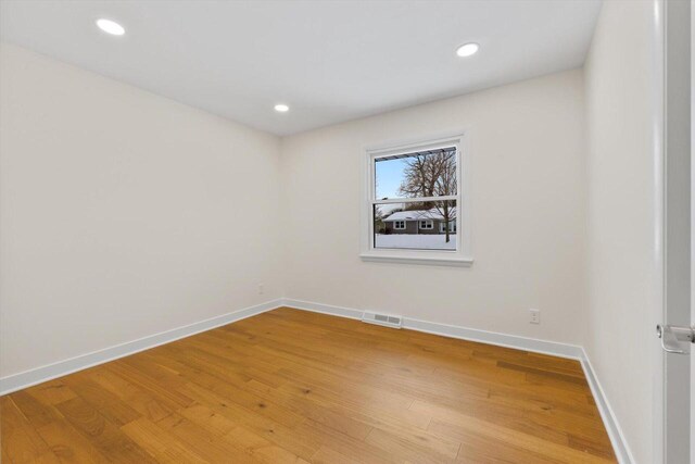 empty room featuring hardwood / wood-style floors