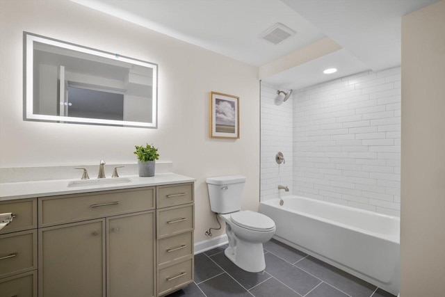 full bathroom with tile patterned flooring, vanity, toilet, and tiled shower / bath
