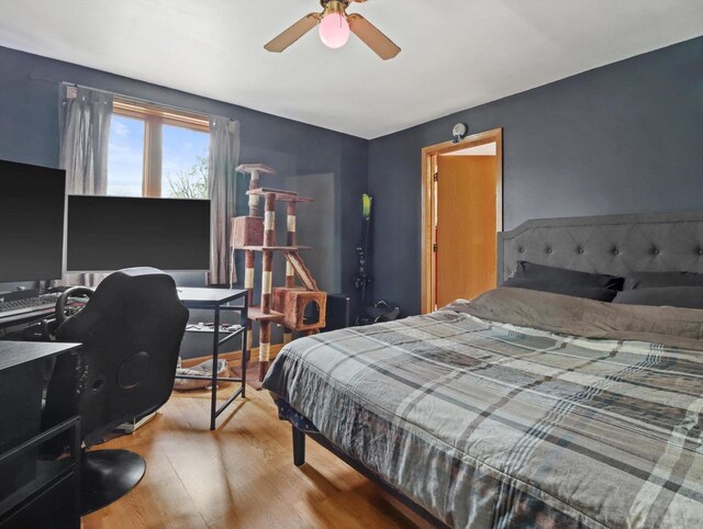 132 E Carroll St, Portage, WI 53901 - bedroom with wood finished floors, an office area, and ceiling fan