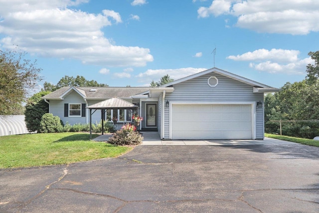 ranch-style house featuring a gazebo, a garage, and a front lawn