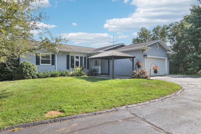 single story home featuring a garage, a front lawn, and a gazebo