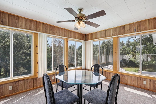 sunroom / solarium featuring a wealth of natural light and ceiling fan