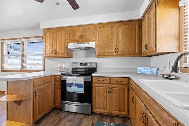 90 Lake St, Oshkosh, WI 54901 - kitchen featuring a sink, under cabinet range hood, stainless steel electric stove, and light countertops